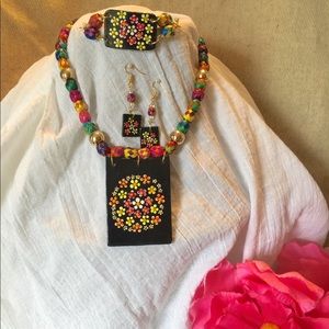 Necklace woven with clay decorative piece